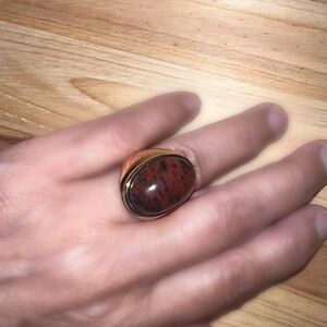 💕#3 A vintage style ring holds a brown obsidian stone in a cool-girl oval shape.